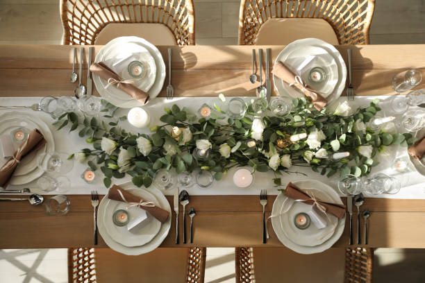 istock Elegant table setting with beautiful floral decor and burning candles, top view 1407073729