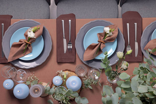 istock Elegant table setting with beautiful floral decor and burning candles, top view 1407073754