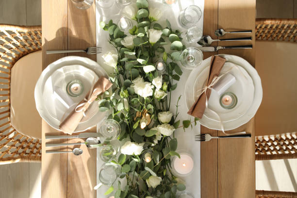 istock Elegant table setting with beautiful floral decor and burning candles, top view 1407074410