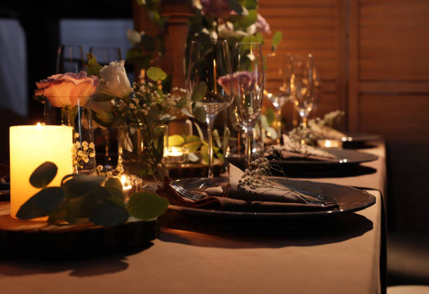 istock Elegant table setting with beautiful floral decor and burning candles 1407074413