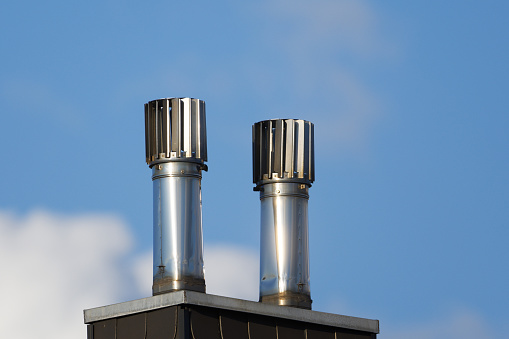 Smoke stacks on the roof of a house