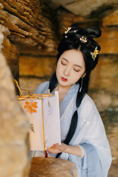 istock Chinese beauties carrying lanterns in caves 1407078526