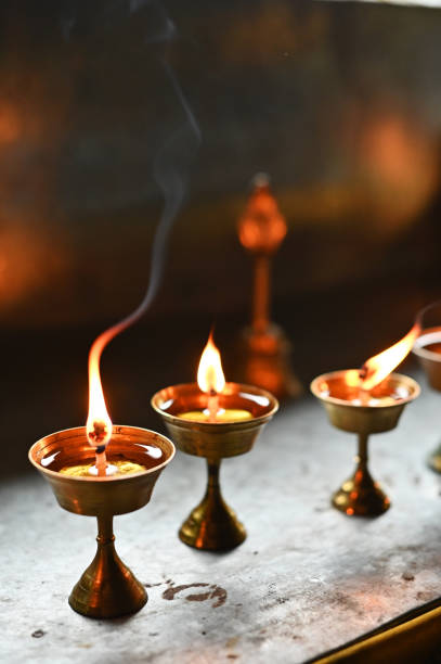 Illuminated Lamps arranged on the table at holy Khecheopalri lake in West Sikkim