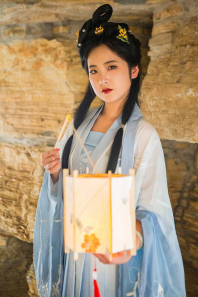 istock Chinese beauties carrying lanterns in caves 1407078855