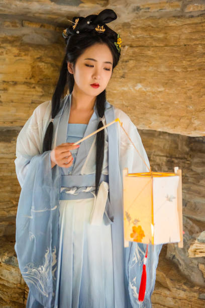 istock Chinese beauties carrying lanterns in caves 1407078859