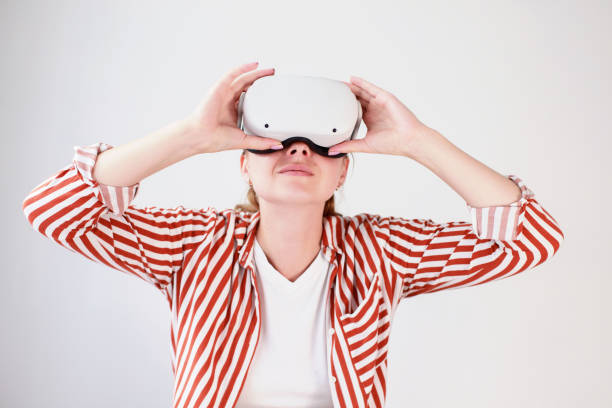 istock woman in virtual reality oculuses on white background 1407080400