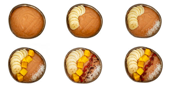 istock Healthy Breakfast. Smoothie bowl step by step. Collage Orange smoothie with mago, banana, goji berries and coconut. 1407082069
