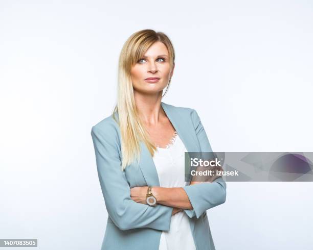 Portrait Of Confident Businesswoman Stock Photo - Download Image Now - Blond Hair, Confidence, Contemplation