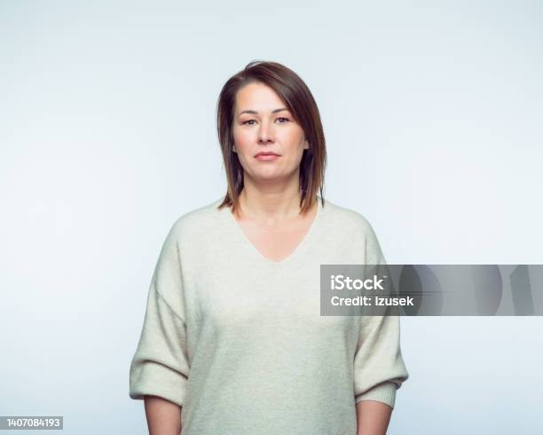 Portrait Of Confiedent Woman Stock Photo - Download Image Now - Serious, One Woman Only, Women