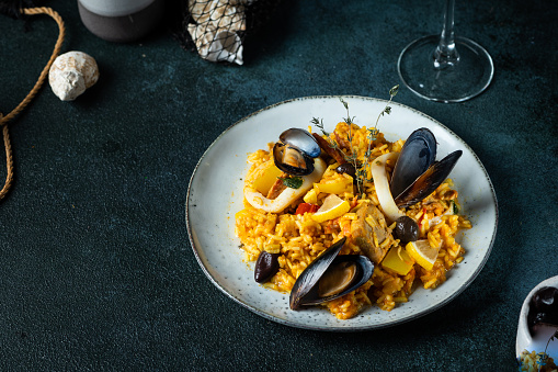 Typical spanish seafood paella in traditional pan. Spanish food. Valencian dish. Rice with seafood