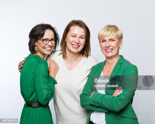 Portrait Of Happy Women Stock Photo - Download Image Now - Women, Green Color, Mature Adult