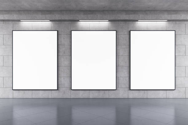 istock Front view on three blank white posters in black frame with space for your text or logo on grey wall background in abstract subway with concrete glossy floor. 3D rendering, mock up 1407084619