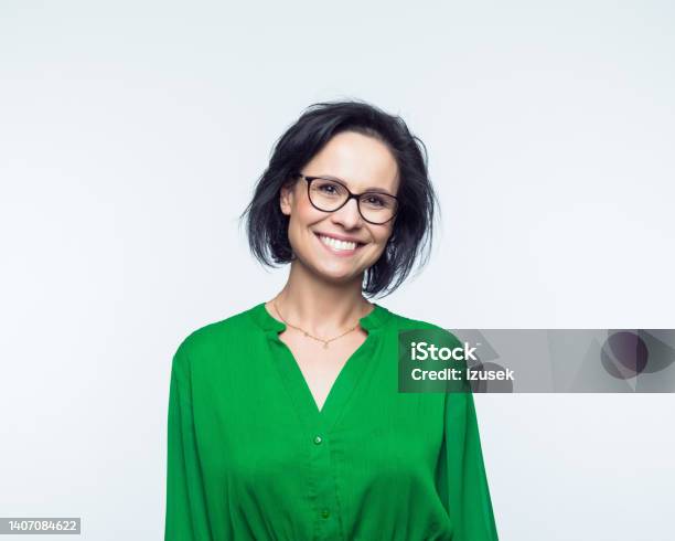 Portrait Of Smiling Mature Women Stock Photo - Download Image Now - Businesswoman, Green Color, Smiling