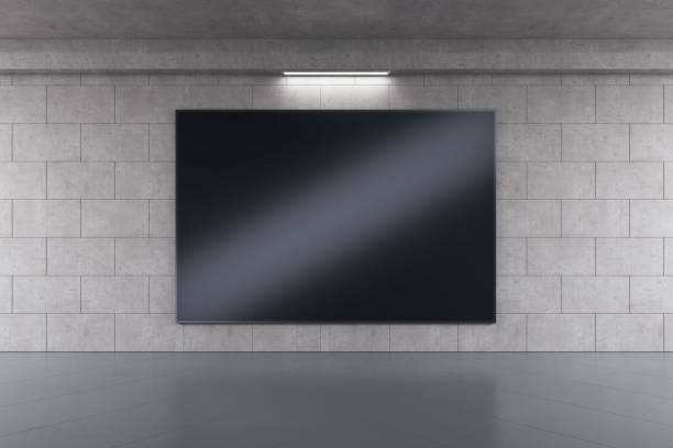 istock Empty black screen banner with reflections in concrete tile urban underground interior. Advertisement and commercial concept. Mock up, 3D Rendering. 1407084696
