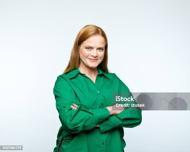 Portrait Of Smiling Mature Women Stock Photo - Download Image Now - Entrepreneur, Smart Casual, Studio Shot