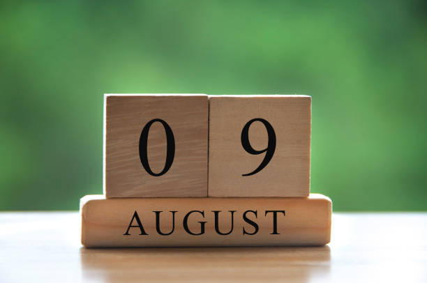 istock August 9 calendar date text on wooden blocks with blurred background park. Copy space and calendar concept 1407084765