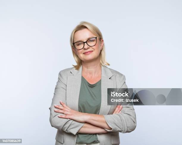 Portrait Of Smiling Mature Women Stock Photo - Download Image Now - Cut Out, Businesswoman, Business Person