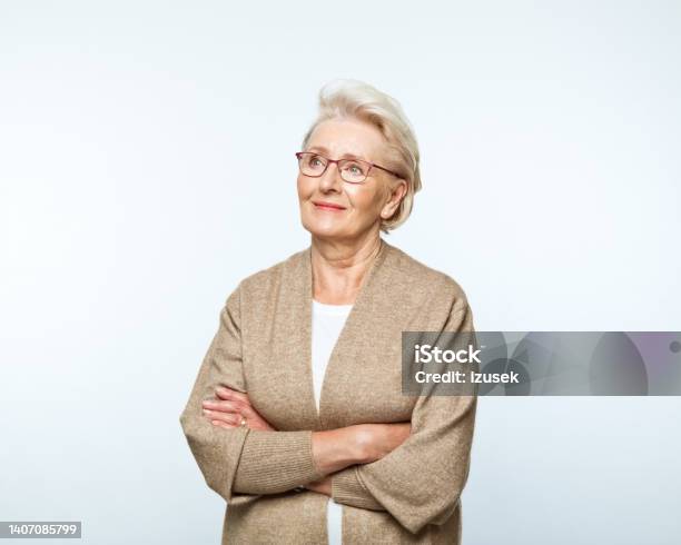 Portrait Of Smiling Senior Women Stock Photo - Download Image Now - Women, Cut Out, One Woman Only