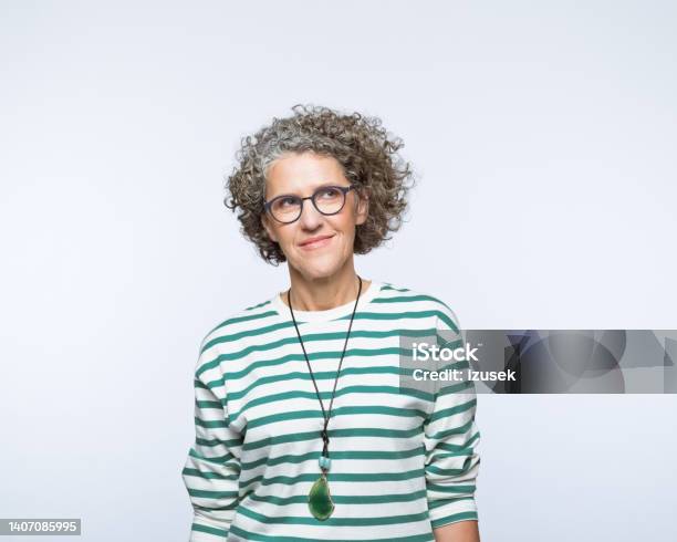 Portrait Of Thoughful Mature Women Stock Photo - Download Image Now - Portrait, Businesswoman, Eyeglasses