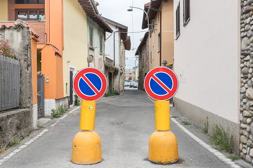 No parking signs blocking road in Italy