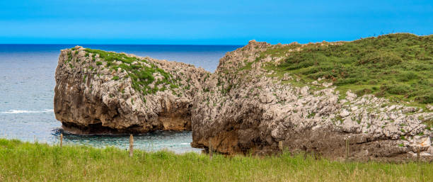 istock Grass Meadows and Cliffs, Buelna, Asturias, Spain 1407087508