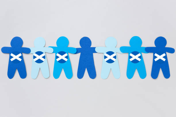 Missing Scottish boy Paper cuts of boys in blue shades holding hands side by side and all but one with a Scottish flag on them special mate stock illustrations