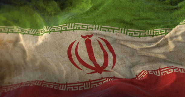 istock Old Iran Flag waving at wind 1407090312