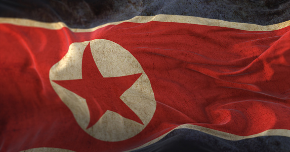 Old North Korea Flag waving at wind