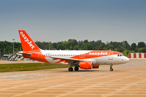 London, England - May 2022: Easyjet Airbus A319 jet (registration G-EZIY) about to depart from the airline's Gatwick airport base.