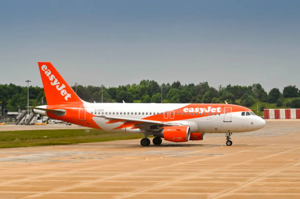 Airbus A319 jet operated by easyJet London, England - May 2022: Easyjet Airbus A319 jet (registration G-EZIY) about to depart from the airline's Gatwick airport base. gatwick airport photos stock pictures, royalty-free photos & images