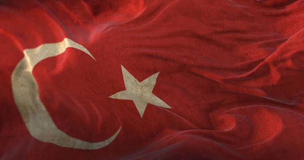 antigua bandera de turquía ondeando al viento - turquia bandera fotografías e imágenes de stock