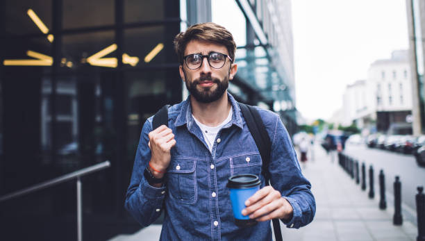 istock Pensive male with coffee on street 1407093799