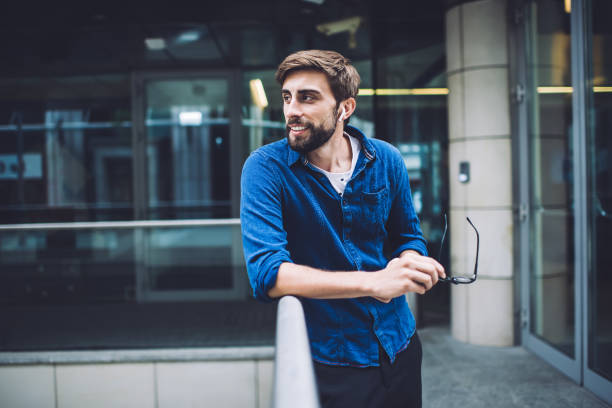 istock Cheerful man observing activity on street 1407093827