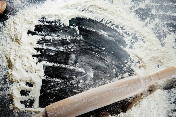 istock Freshly cooked pasta is lying on a dark surface dusted with flour. Italian pasta. Tagliatelle. Raw pasta. Italian pasta recipe. Top view, copy space 1407094753