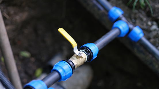 Water valve connected to PVC pipe. Irrigation system for fields concept