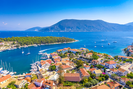 Aerial drone view of Fiscardo village port with luxury boats and yachts on Kefalonia island, Greece