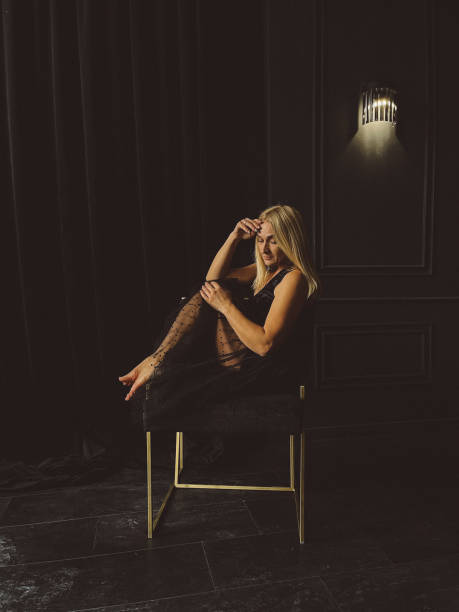 istock Sexy girl posing while sitting on a chair. 1407099339