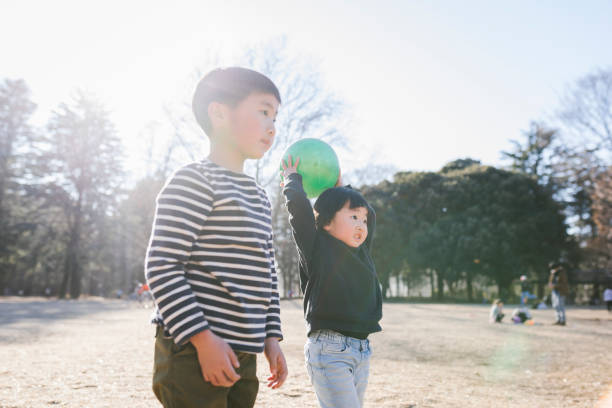 istock Siblings playing in the park 1407099851