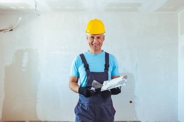 istock Male painter with a spatula in his hands 1407100041