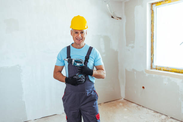 istock Portrait of manual worker with a drill 1407100952