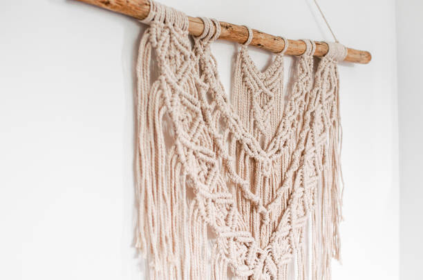 istock threads in the style of macrame on a white background 1407101341