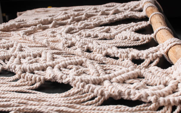 istock threads in the style of macrame on a black background 1407101445