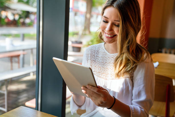 istock People tablet work connection technology concept. Happy woman using digital tablet . 1407102458