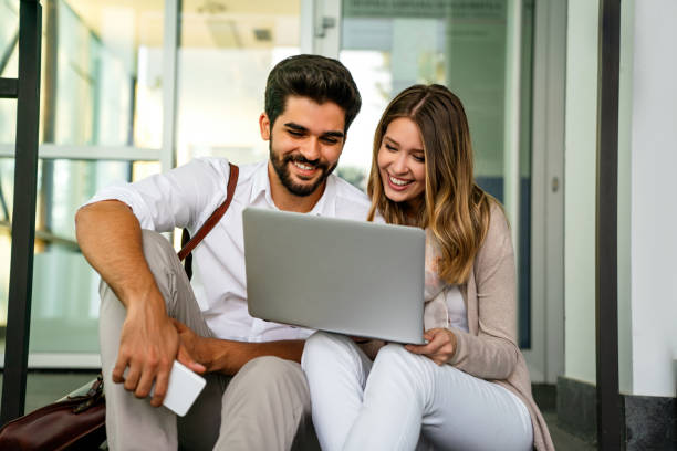 istock Young people working, studying together with digital devices. Business education technology concept 1407102520