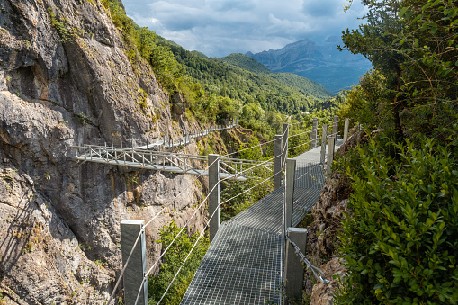 Footpath of the metal footbridge in the mountain in the town of Panticosa in the Pyrenees, Huesca