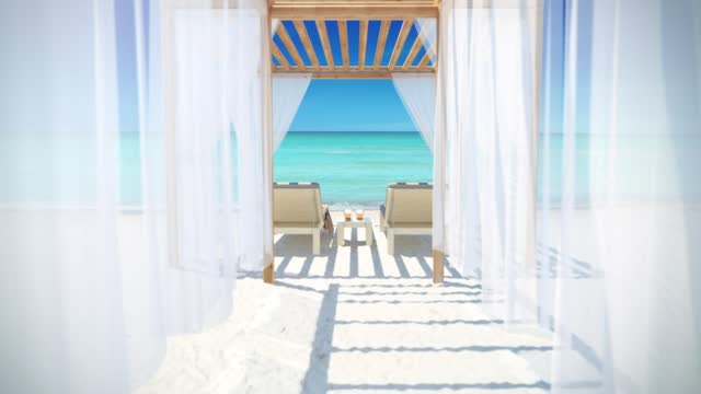 Paradise beach with azure water. Relax on the pergola with two sun loungers and drinks.