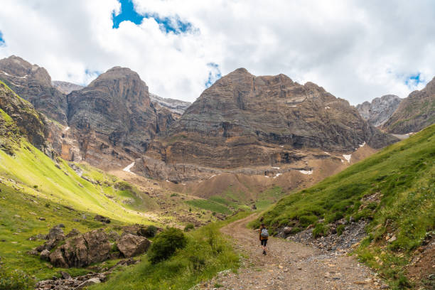 A young hiker on a trail in the Pyrenees in the Ripera Valley, Huesca
