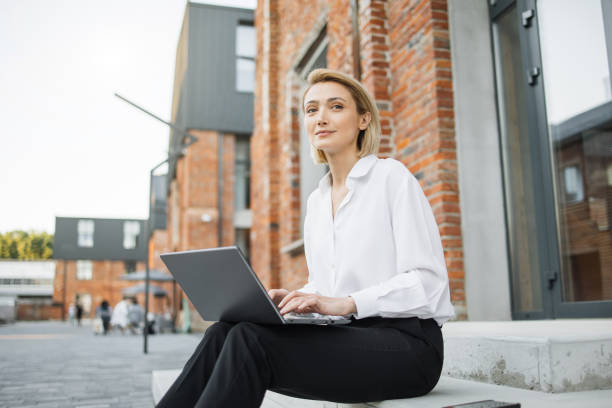 istock Smiling woman freelancer enjoying favorite work during break. 1407108626