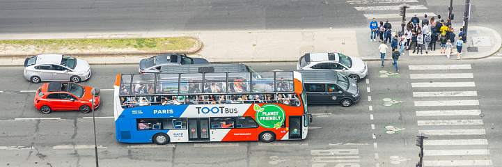 Toot Bus, an open tour bus visiting the streets of Paris, France
