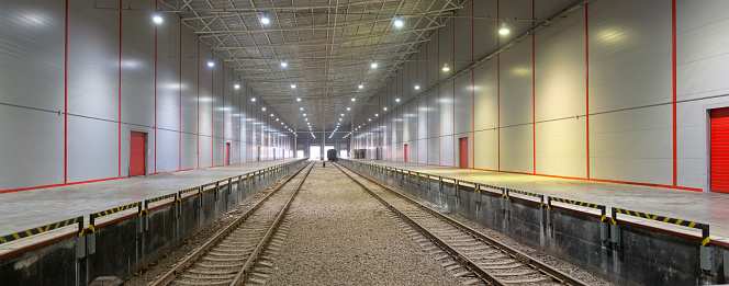 Empty railway platform without passengers in blizzard/heavy snowfall at night. Railway, bad weather